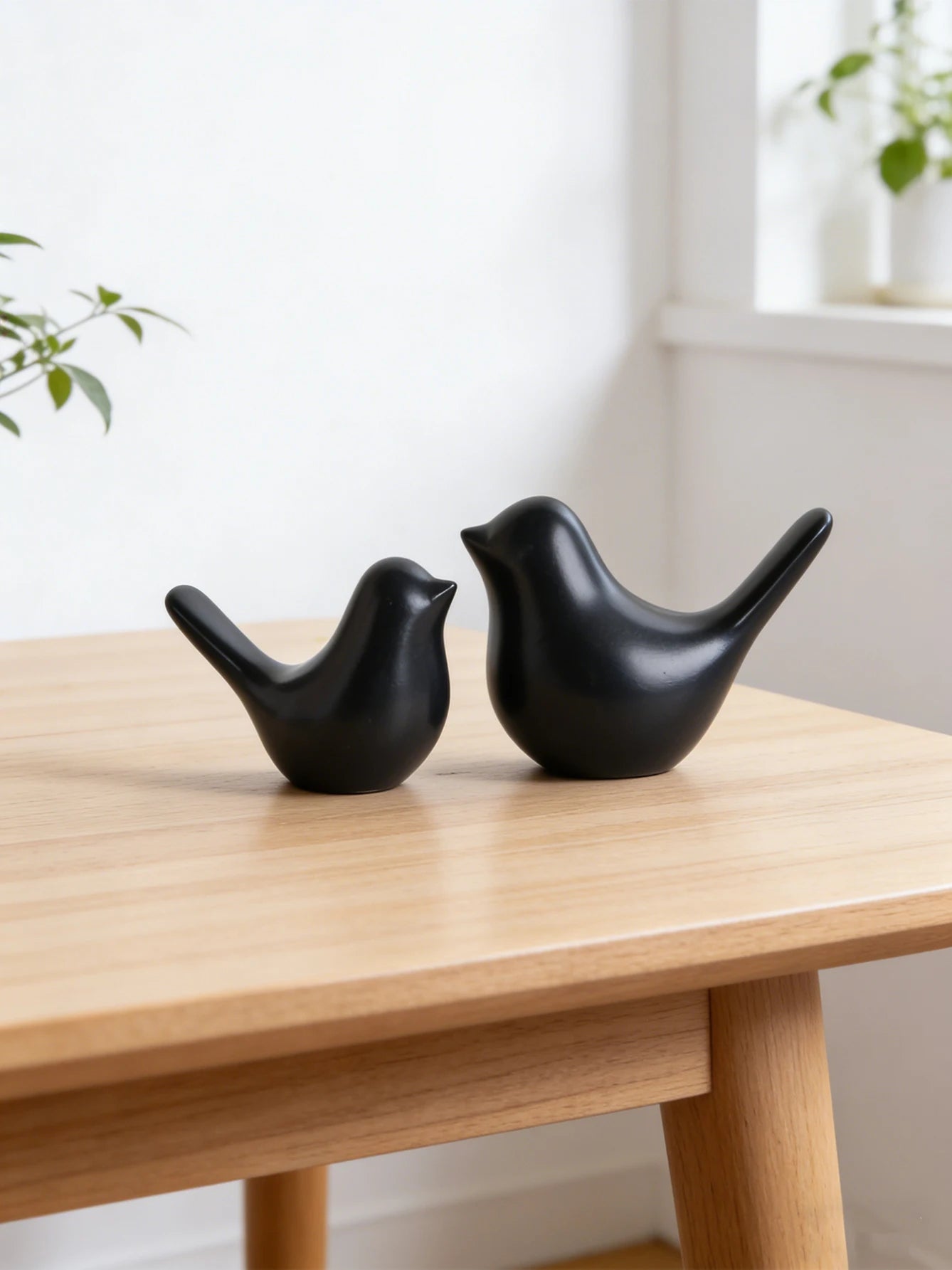 A pair of Eames Bird sculptures, small resin bird figurines, home decor for bedrooms, living rooms, and study desks.